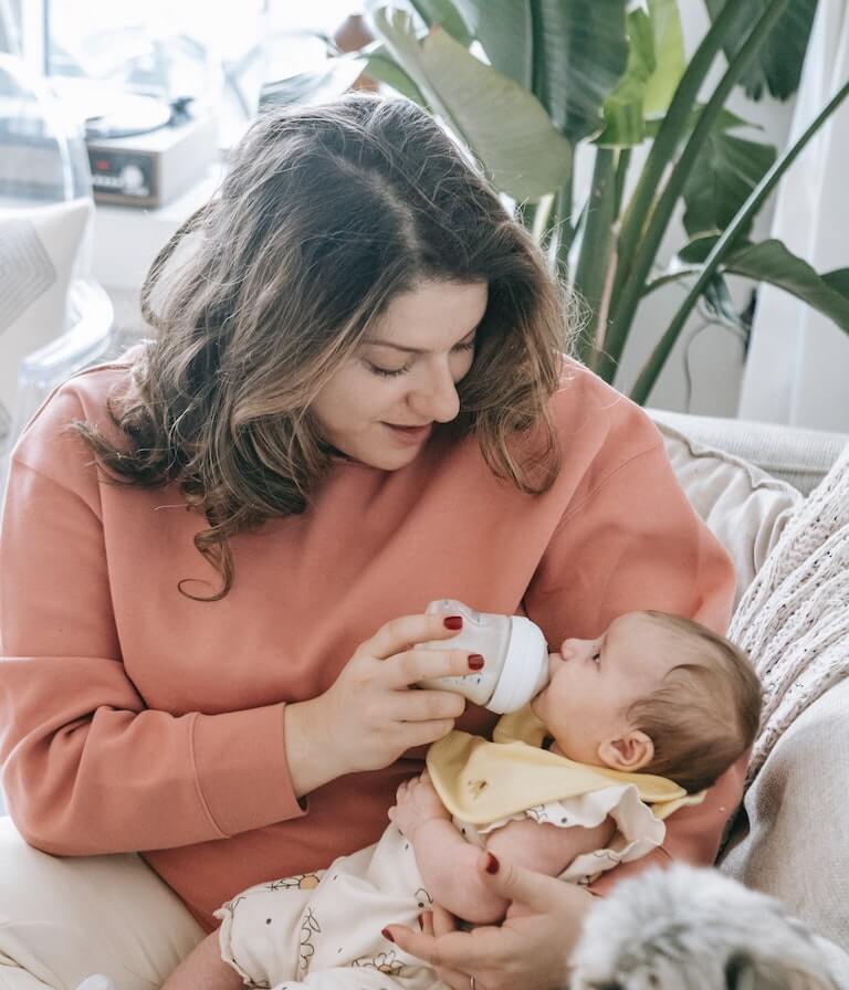 A mother feeding her baby