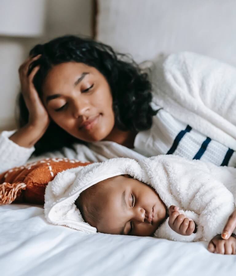 Mother Looking at Her Sleeping Baby